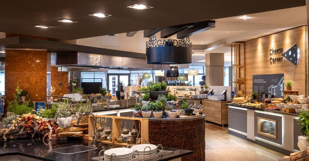 a store with a lot of plants on display at Valamar Diamant Hotel in Poreč