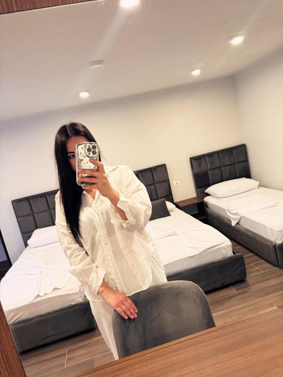 Een bed of bedden in een kamer bij Andor Luxury Hotel & Duplex