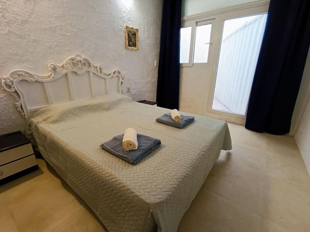 Ένα ή περισσότερα κρεβάτια σε δωμάτιο στο La Cueva Encantada