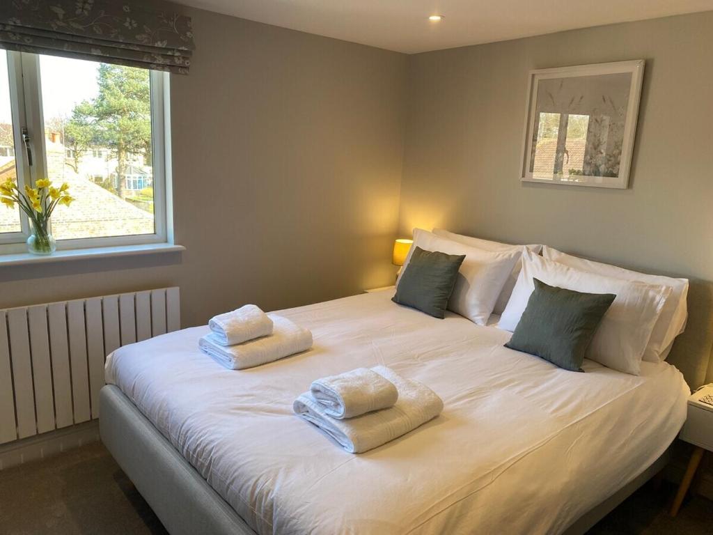 Ένα ή περισσότερα κρεβάτια σε δωμάτιο στο Jasmine Cottage