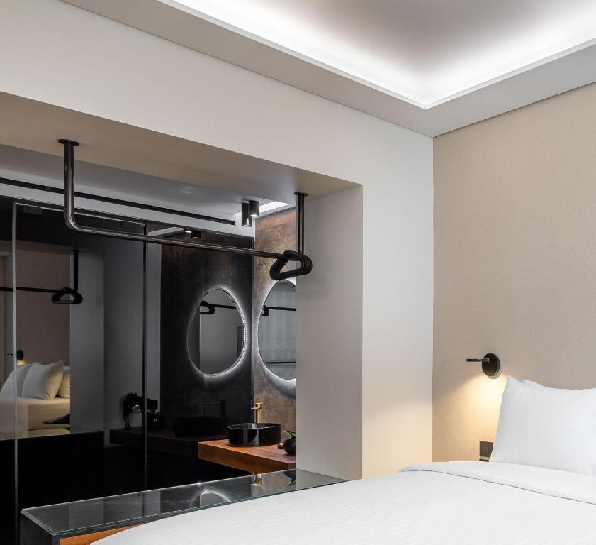 Posteľ alebo postele v izbe v ubytovaní Amazon Hotel