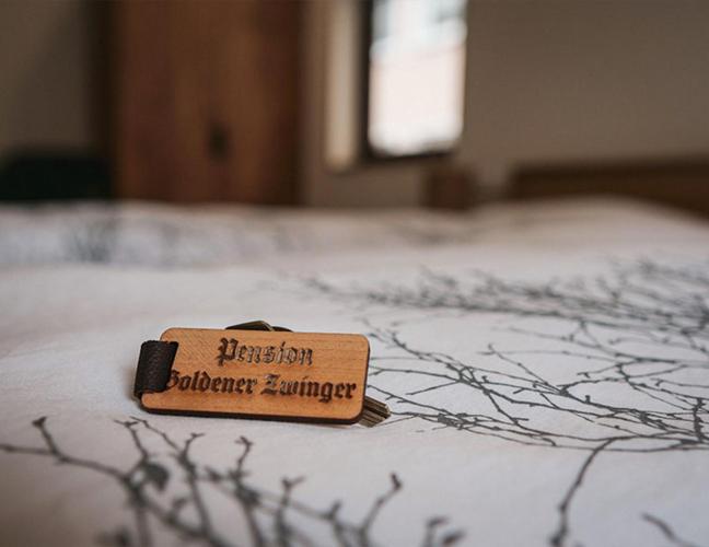 Postel nebo postele na pokoji v ubytování Pension Goldener Zwinger