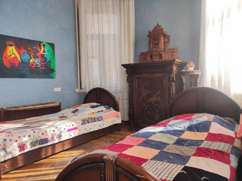Postel nebo postele na pokoji v ubytování Guest House Irina Tbilisi