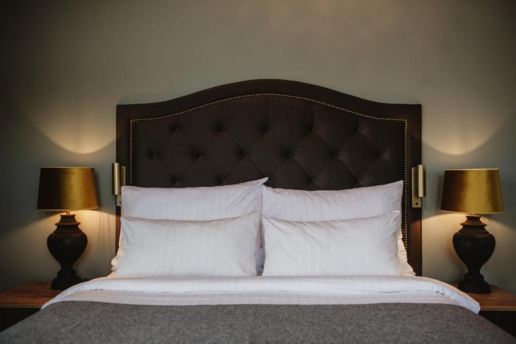 Postel nebo postele na pokoji v ubytování Home Hotel Christian IV
