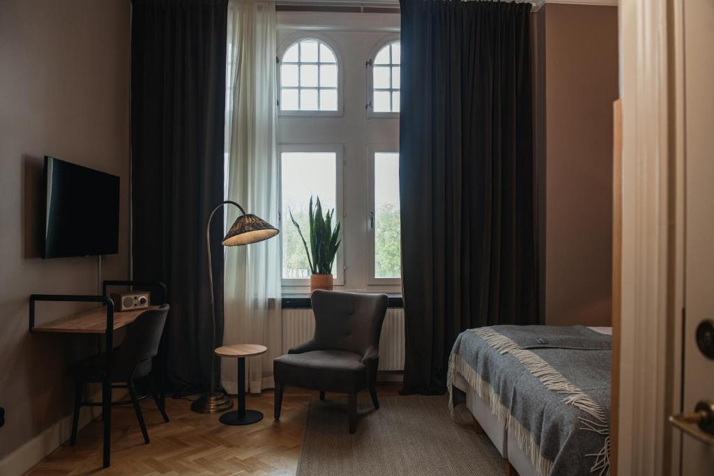 TV a/nebo společenská místnost v ubytování Home Hotel Christian IV