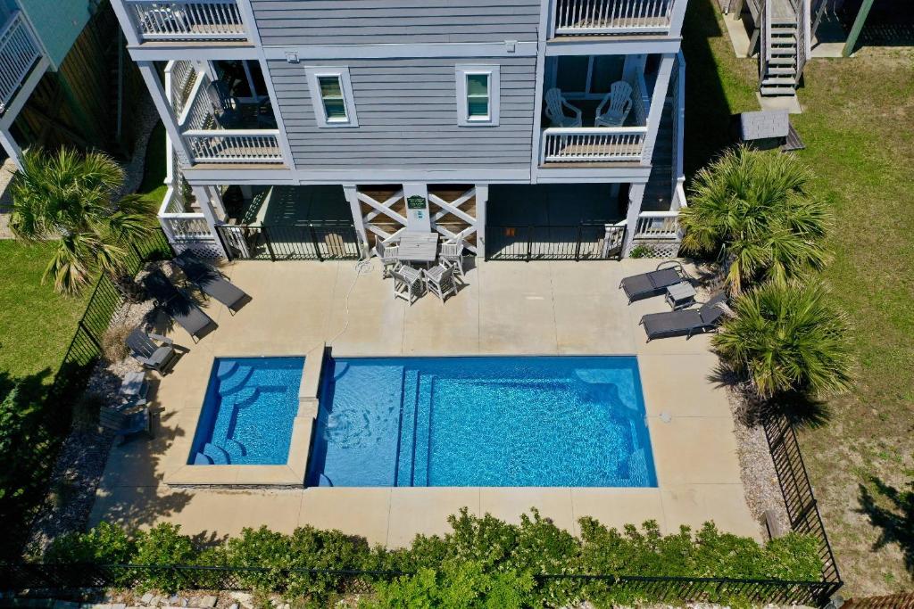 an aerial view of a house with two swimming pools at Blue Oasis in Carolina Beach
