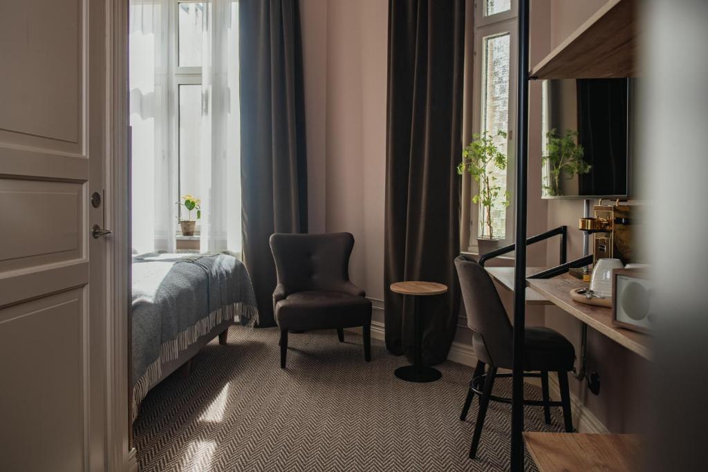 Postel nebo postele na pokoji v ubytování Home Hotel Christian IV