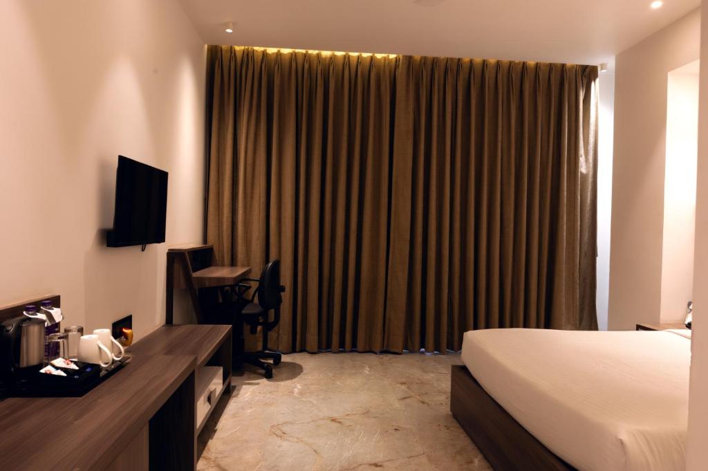 TV a/nebo společenská místnost v ubytování ECONEST HOTEL