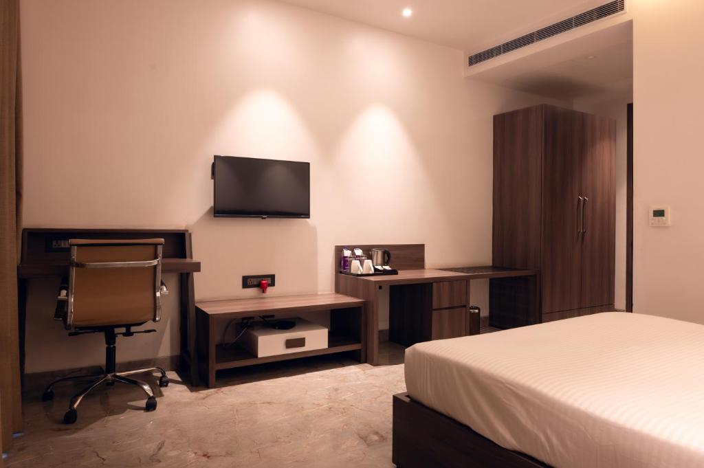 TV a/nebo společenská místnost v ubytování ECONEST HOTEL