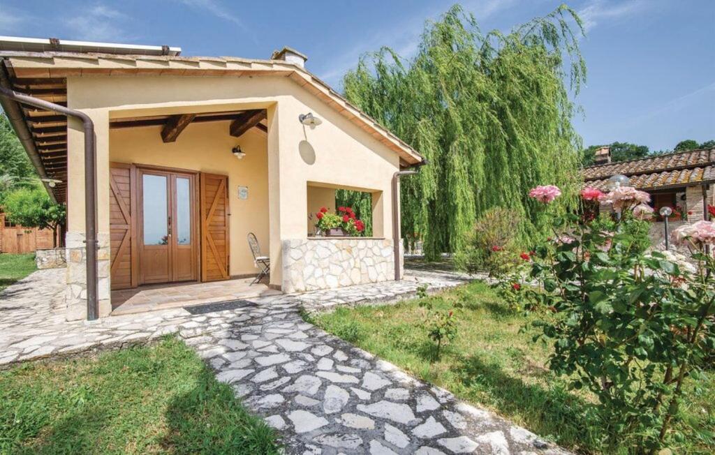 a small house with a door and a garden at Casa Lavanda, Ac, Wifi, Narni in Narni