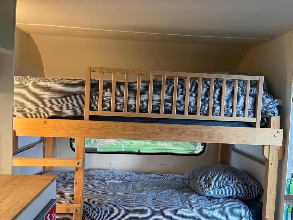Postel nebo postele na pokoji v ubytování Glamping 't Hoveke