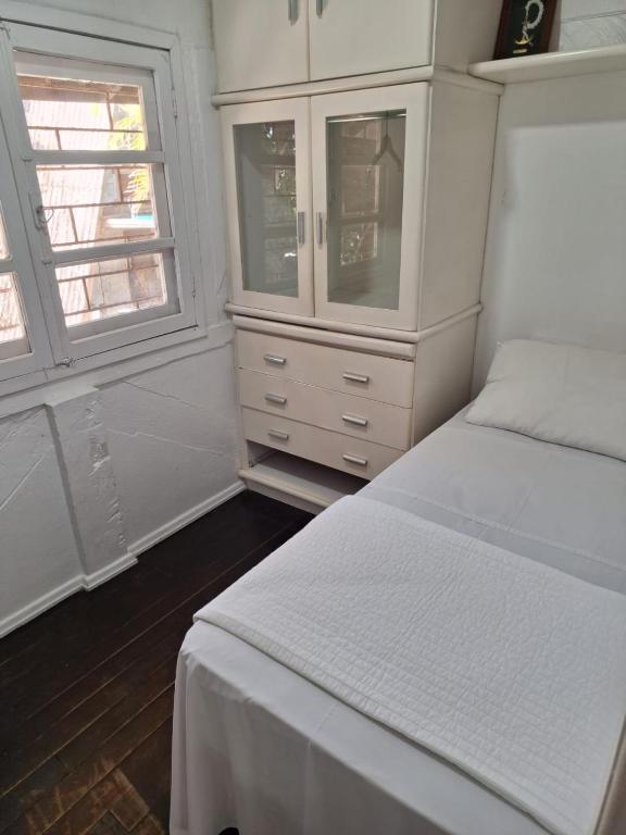 Cama ou camas em um quarto em Pousada Caminho do Mar