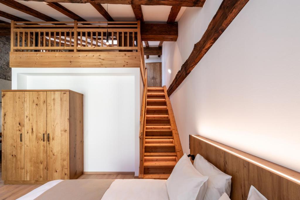 Postel nebo postele na pokoji v ubytování Hotel Traube Rattenberg