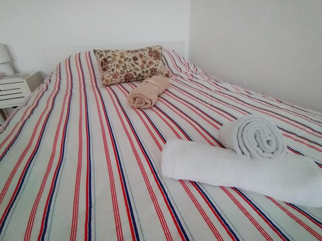 Postel nebo postele na pokoji v ubytování Chez Marcel la Briza Dunării