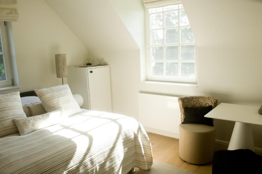 Postel nebo postele na pokoji v ubytování B&B Interludium