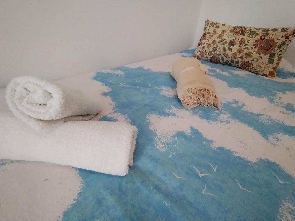 Postel nebo postele na pokoji v ubytování Chez Marcel la Briza Dunării