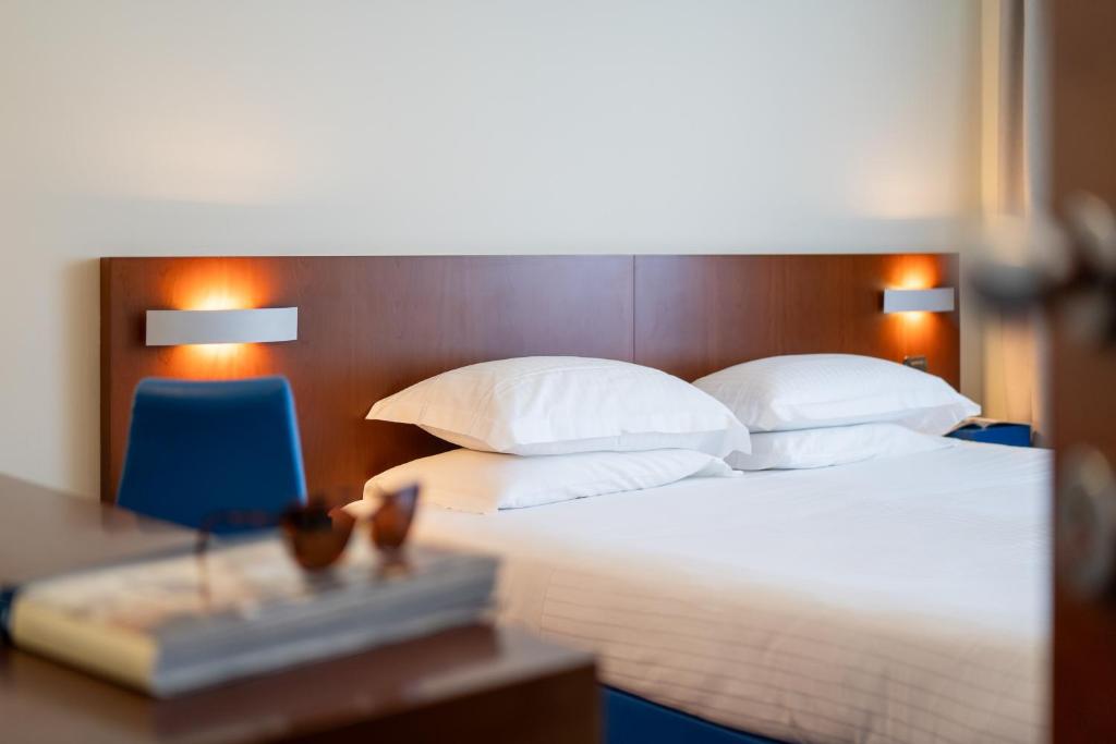 Postel nebo postele na pokoji v ubytování Hotel Balance