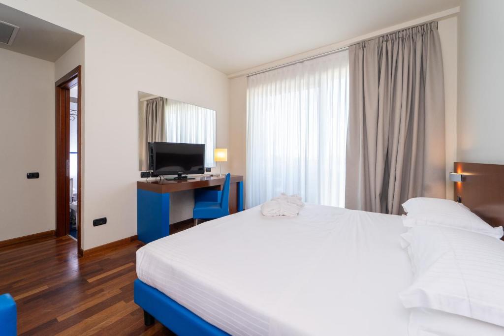 Postel nebo postele na pokoji v ubytování Hotel Balance
