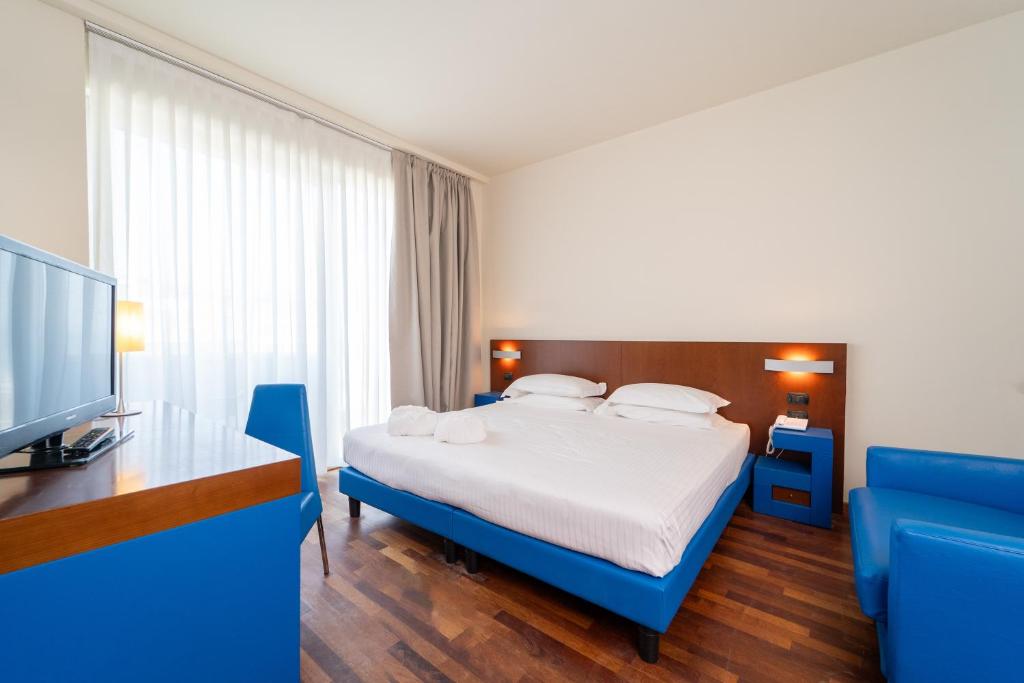 Postel nebo postele na pokoji v ubytování Hotel Balance
