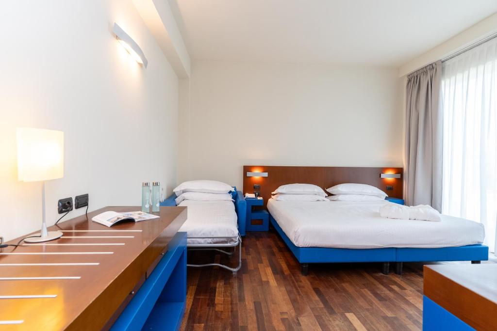 Postel nebo postele na pokoji v ubytování Hotel Balance