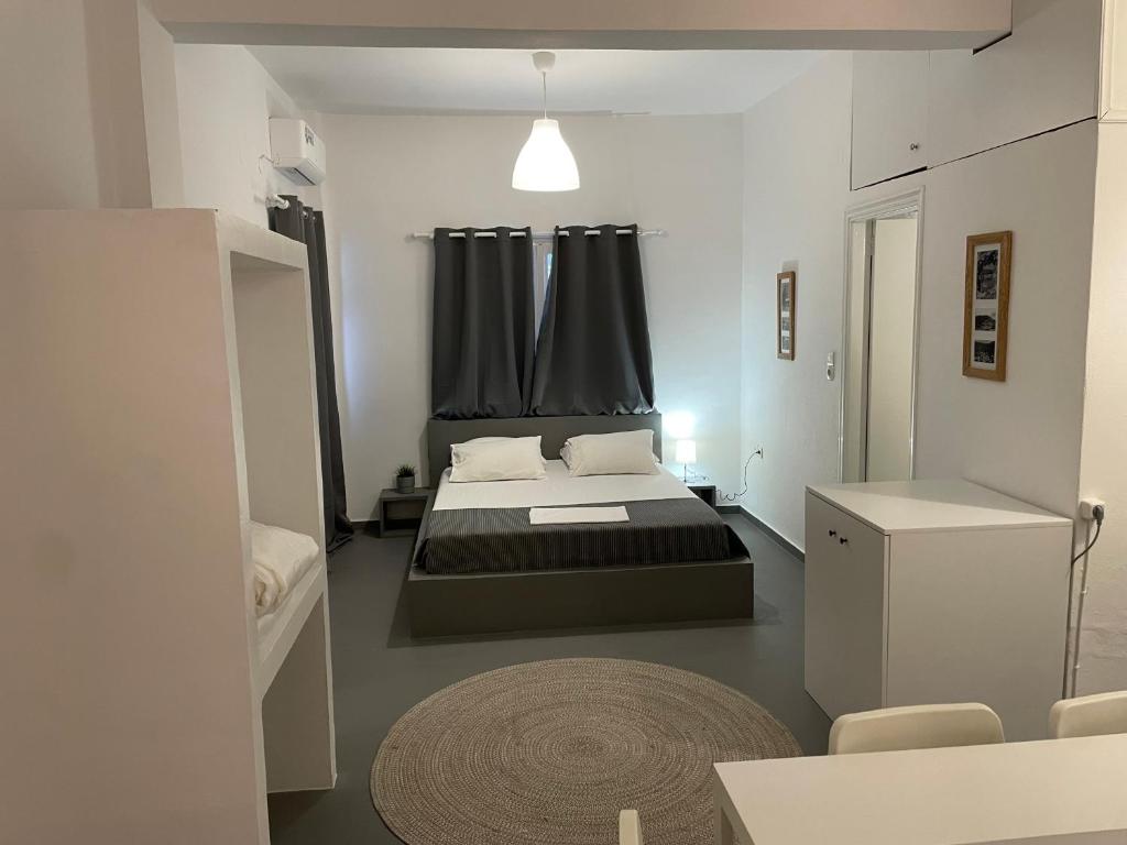 Postel nebo postele na pokoji v ubytování Spanos Apartments - Panteli