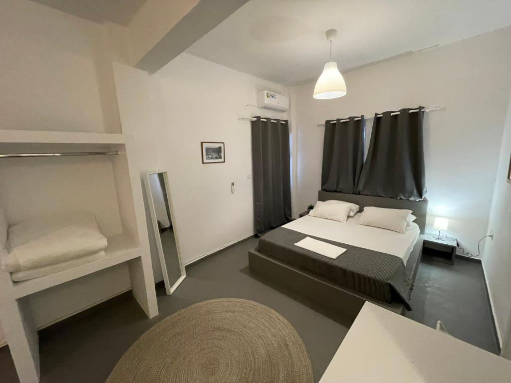Postel nebo postele na pokoji v ubytování Spanos Apartments - Panteli