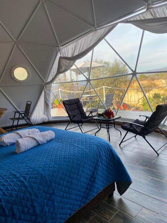 Postel nebo postele na pokoji v ubytování El Gato Glamping con vista a prismas basálticos