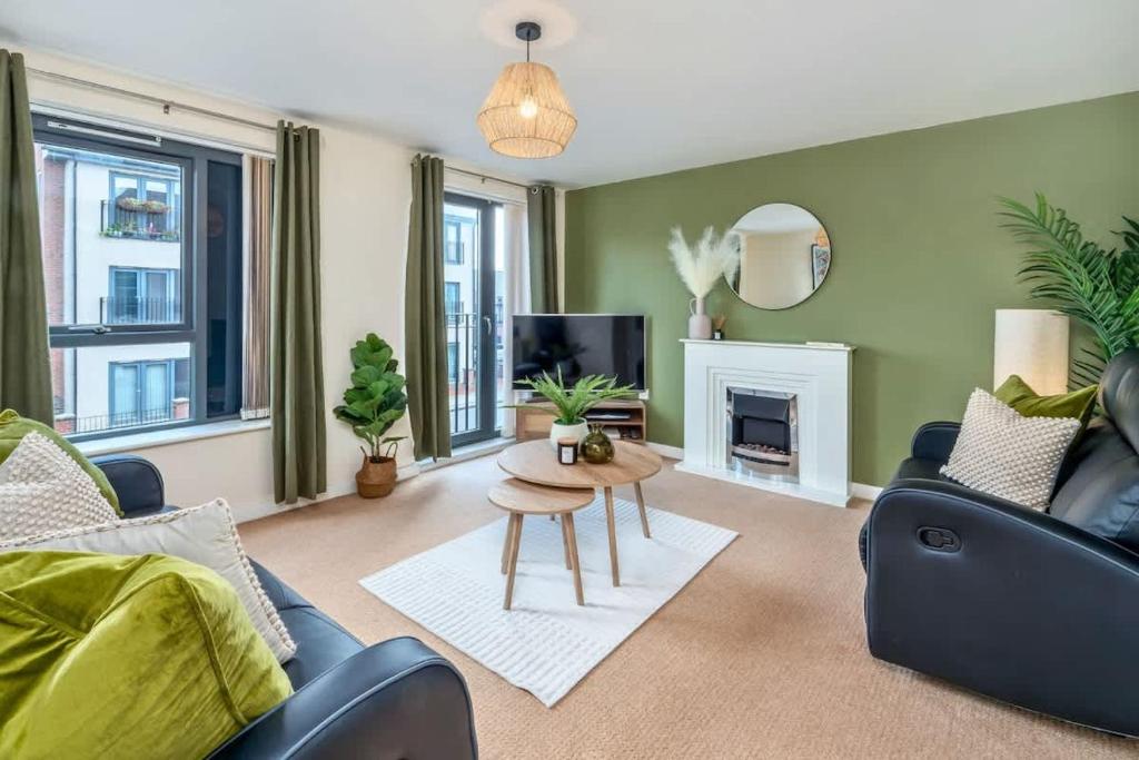 a living room with a couch and a table at NEW Greydawn House - Stunning 4 Bedroom House in Stoke-on-Trent in Stoke on Trent
