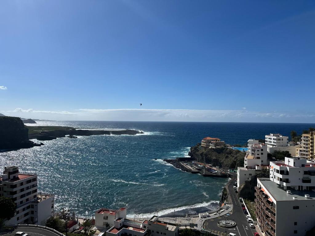 a view of the ocean from a city at Tili apartment with ocean view in San Marcos