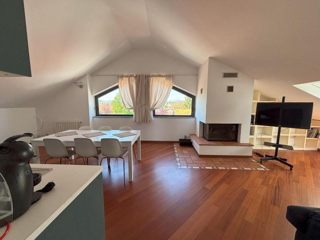 Televízia a/alebo spoločenská miestnosť v ubytovaní Casa Vacanze Magnolia