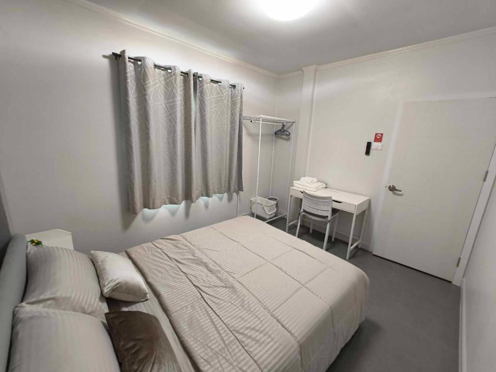 Postel nebo postele na pokoji v ubytování Sawadee Guesthouse Suvarnabhumi