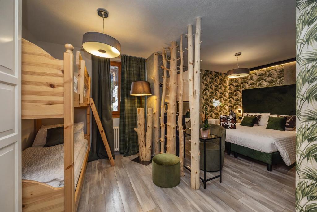 Postel nebo postele na pokoji v ubytování Hotel Folgarida