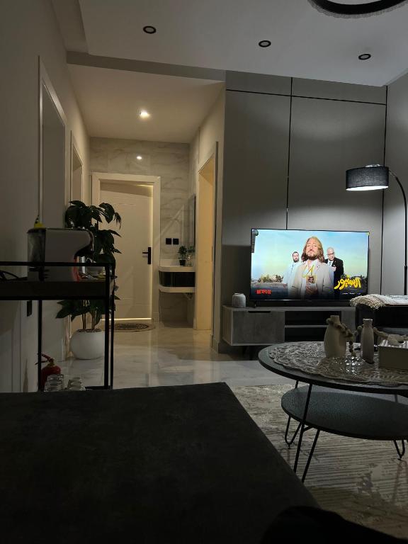 a living room with a flat screen tv at مادير 1 in Jeddah