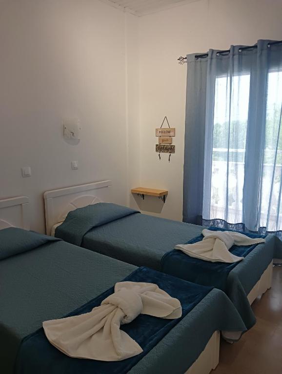 Postel nebo postele na pokoji v ubytování Casa Maria Sidari