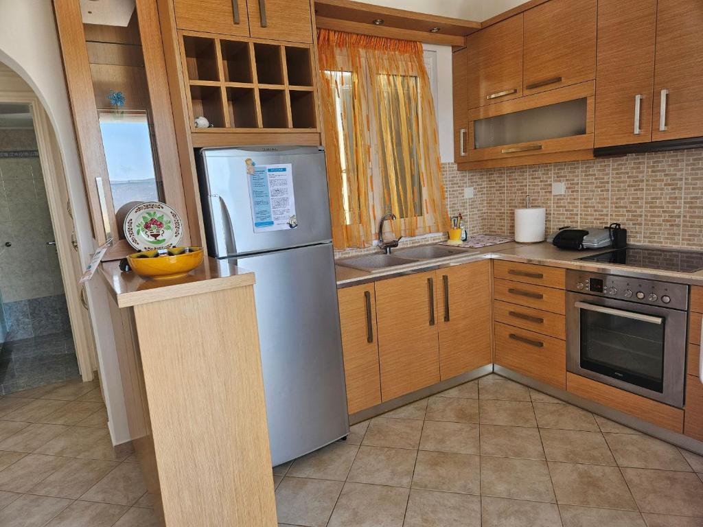 Kuchyň nebo kuchyňský kout v ubytování Trypiti Sea View Apartment