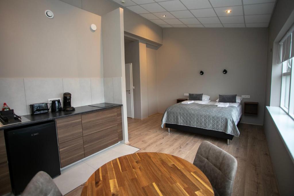 Postel nebo postele na pokoji v ubytování Skýjaborg Apartments
