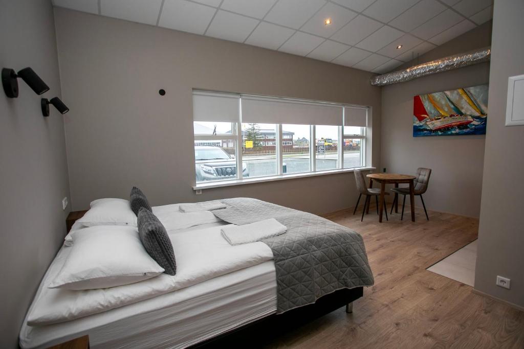 Postel nebo postele na pokoji v ubytování Skýjaborg Apartments