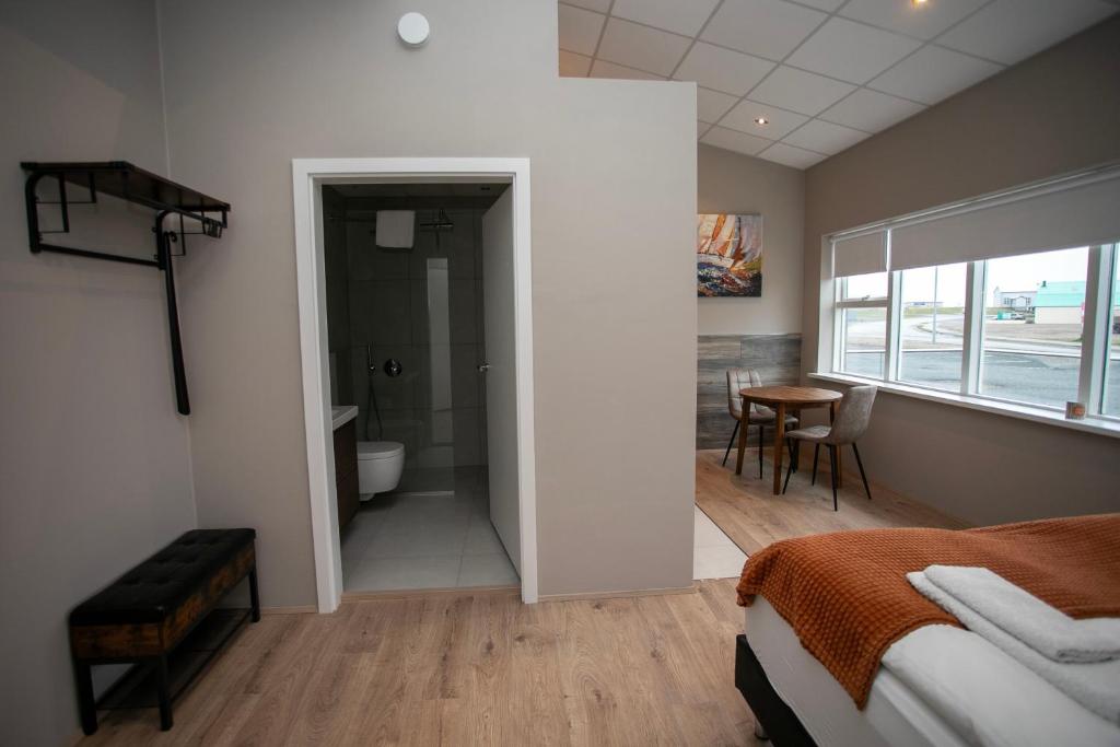 Postel nebo postele na pokoji v ubytování Skýjaborg Apartments