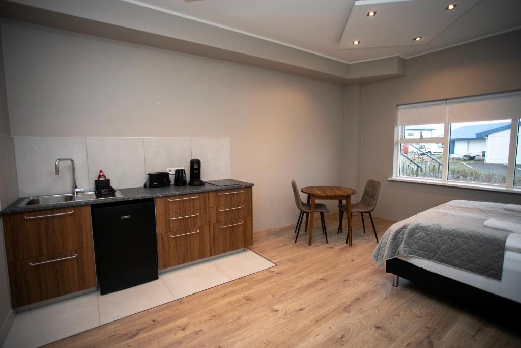 Postel nebo postele na pokoji v ubytování Skýjaborg Apartments