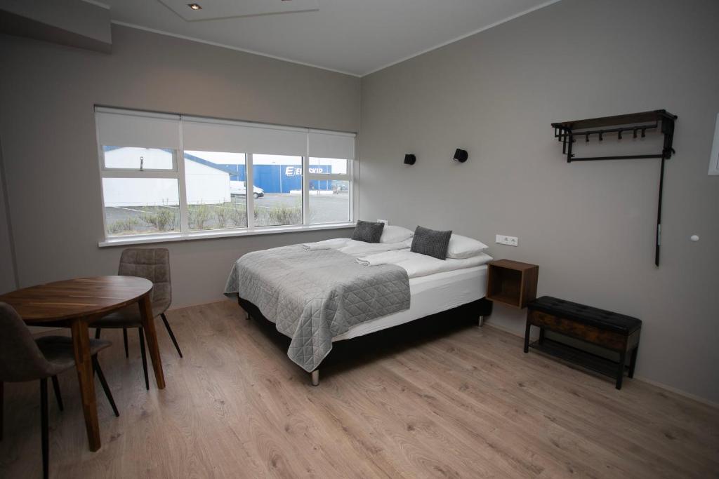 Postel nebo postele na pokoji v ubytování Skýjaborg Apartments
