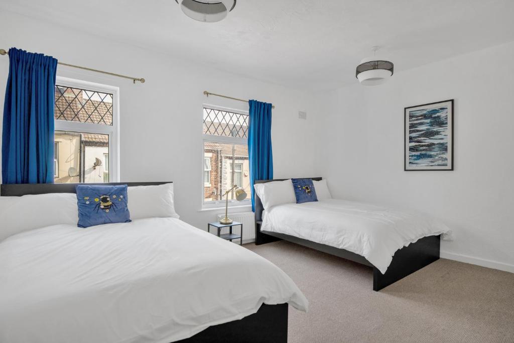 Ένα ή περισσότερα κρεβάτια σε δωμάτιο στο Ideal 3-bed House, Free Parking!