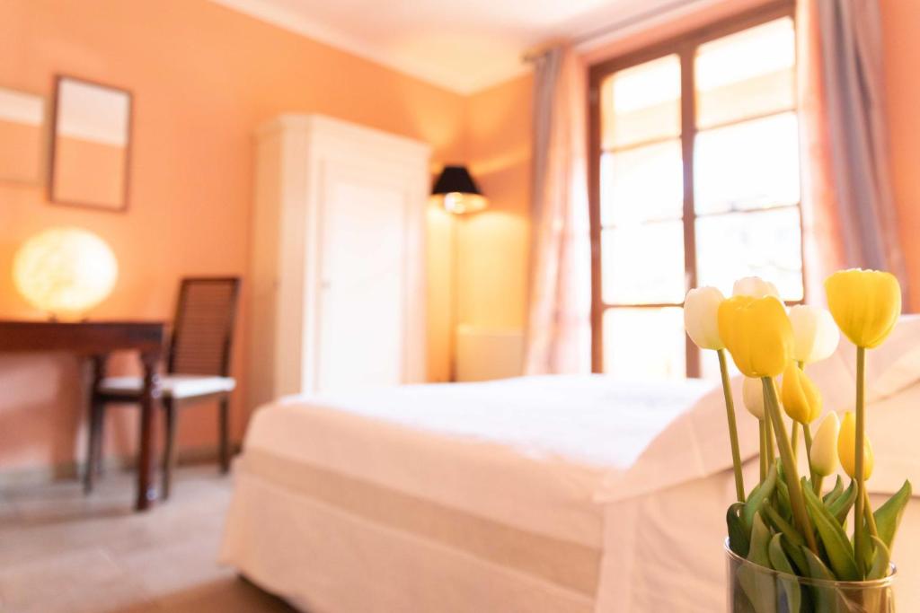 Postel nebo postele na pokoji v ubytování Casa Cardinali