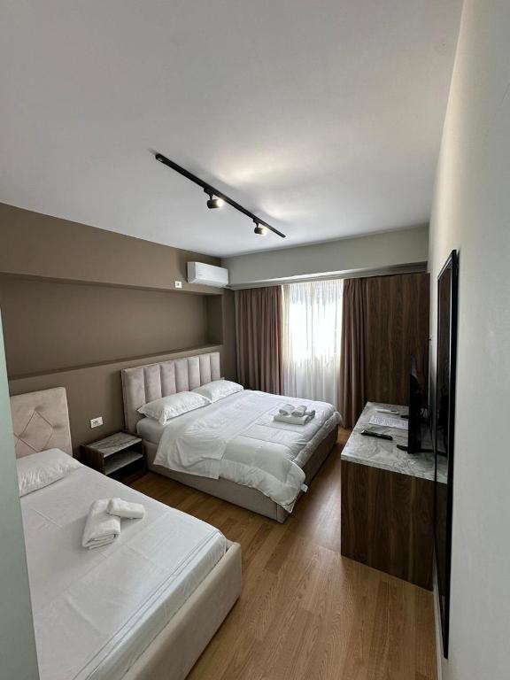 Postel nebo postele na pokoji v ubytování Hotel HER