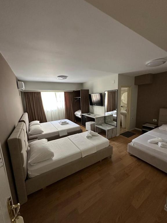Postel nebo postele na pokoji v ubytování Hotel HER