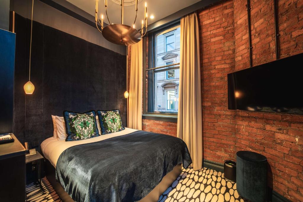 Postel nebo postele na pokoji v ubytování Forty Seven Hotel Manchester, WorldHotels Crafted