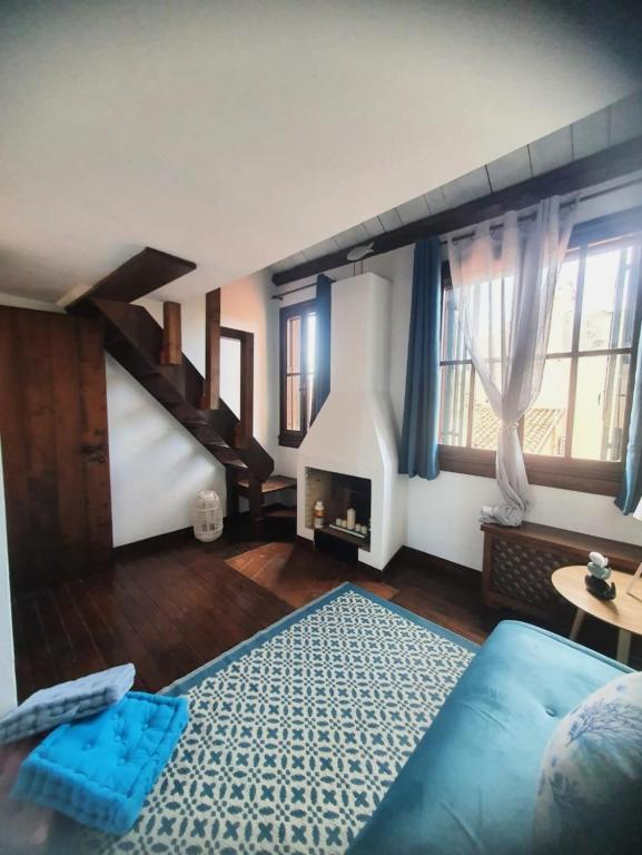 a living room with a couch and a staircase at Ca' del Bovolo in Chioggia