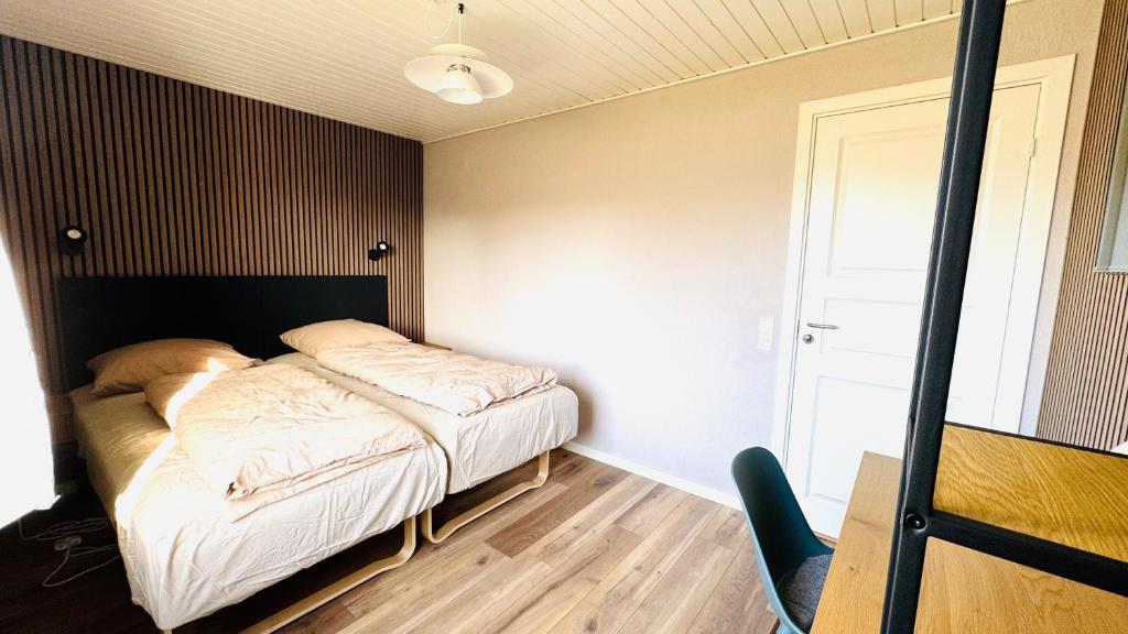 Ein Bett oder Betten in einem Zimmer der Unterkunft Guest Home Oksbøl