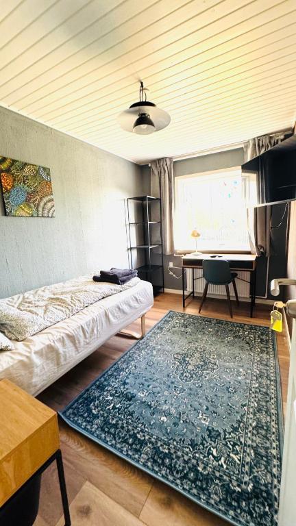 Ein Bett oder Betten in einem Zimmer der Unterkunft Guest Home Oksbøl