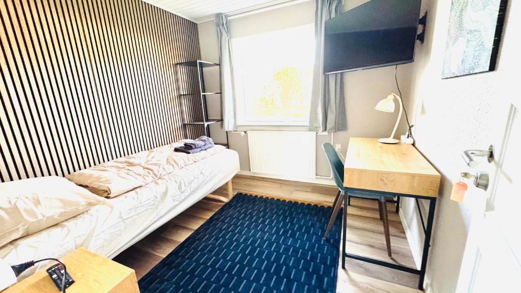 Ein Bett oder Betten in einem Zimmer der Unterkunft Guest Home Oksbøl