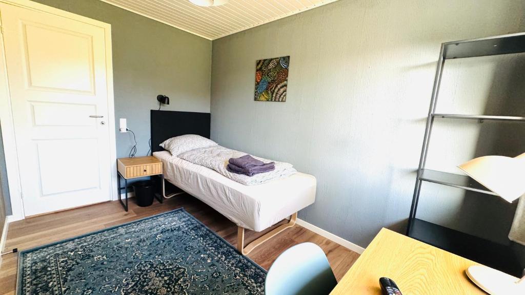 Ein Bett oder Betten in einem Zimmer der Unterkunft Guest Home Oksbøl